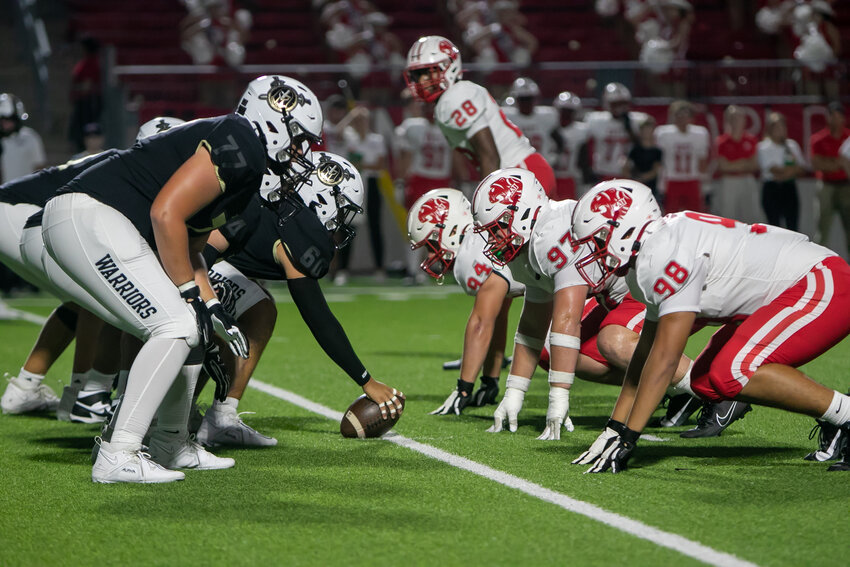 Jordan's offensive line and Katy's defensive line lines up for a play during Friday's game between Katy and Jordan at Legacy Stadium.