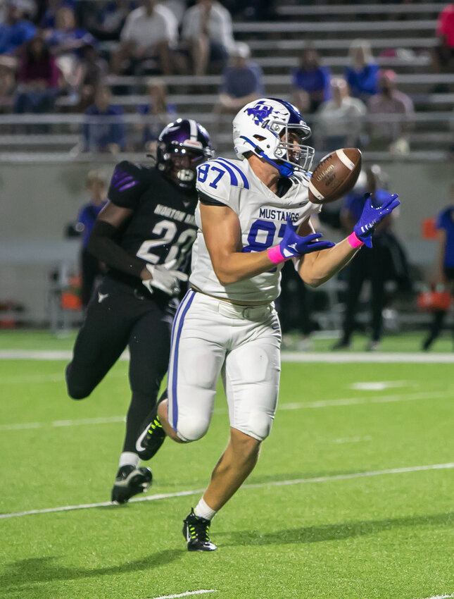 Ian Flynt brings in a pass during Thursday's game between Taylor and Morton Ranch at Legacy Stadium.