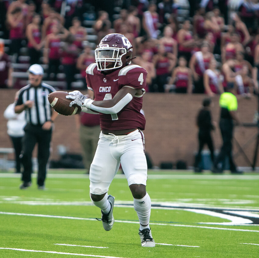 Tessiah Young catches a pass during Friday's game between Jordan and Cinco Ranch at Rhodes Stadium.