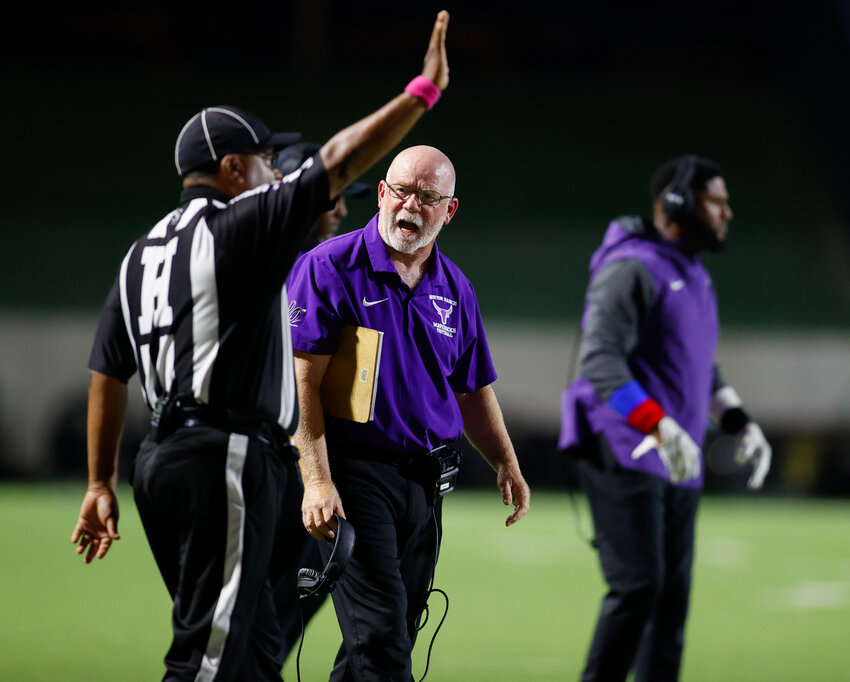 Morton Ranch head coach Ron Counter discusses a play with a game official during a high school football game between Morton Ranch and Tompkins on October 13, 2023, in Katy.