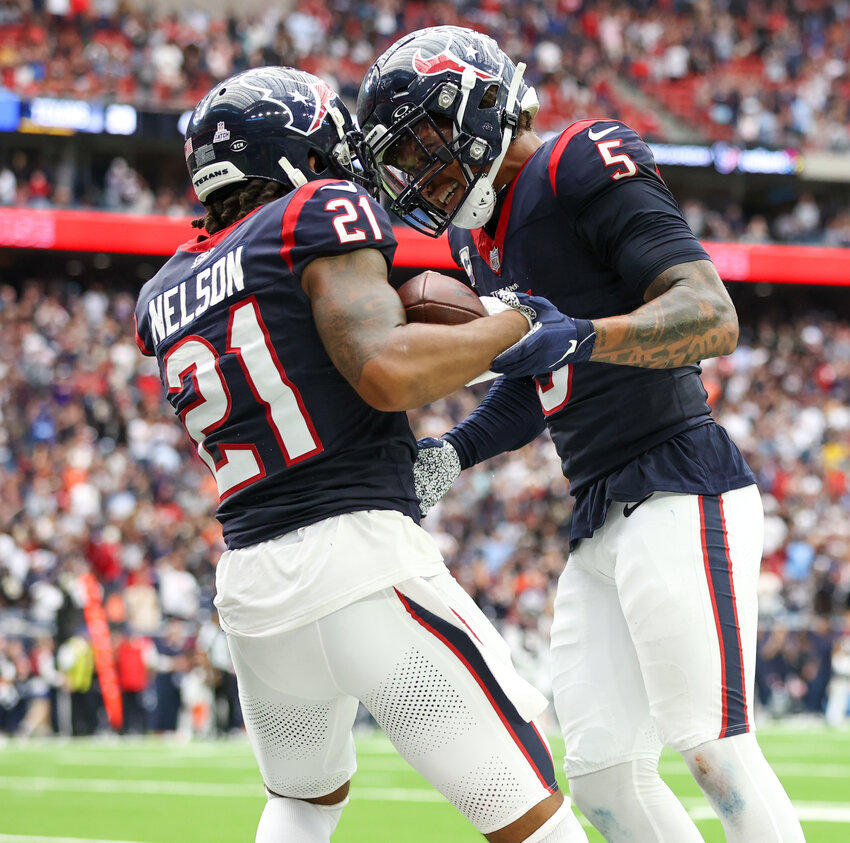Texans cornerback Steven Nelson (21) celebrates with safety Jalen Pitre (5) after Nelson made an interception to end the Saints&rsquo; final opportunity to tie the game in an NFL game between the Texans and the Saints on October 15, 2023 in Houston. The Texans won, 20-13.