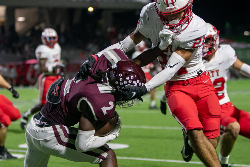 Superior Hill is brought down during a kick return during Thursday's game between Katy and Cinco Ranch at Legacy Stadium