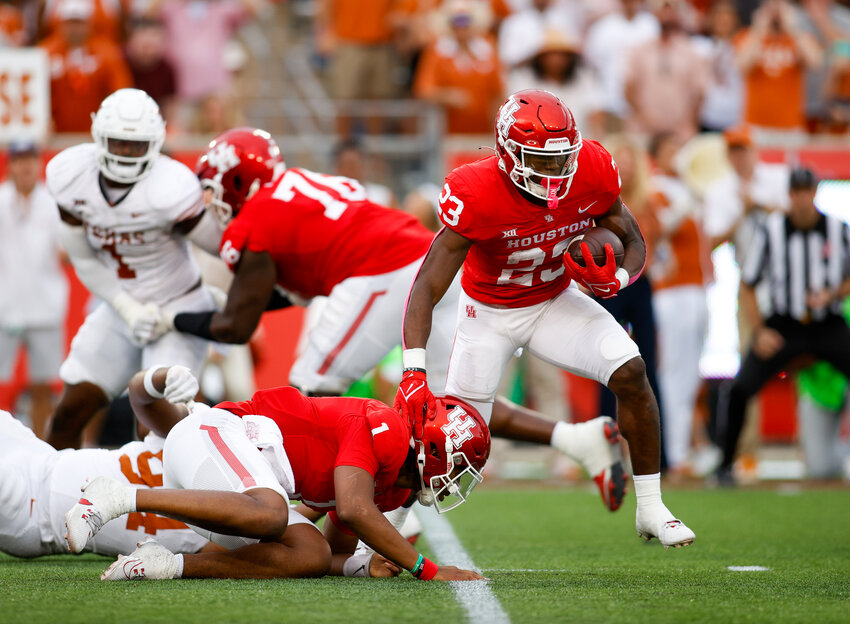 Houston running back Parker Jenkins (23) carries the ball during a Big 12 Conference football game between the Houston Cougars and the Texas Longhorns on October 21, 2023 in Houston. Texas won, 31-24.