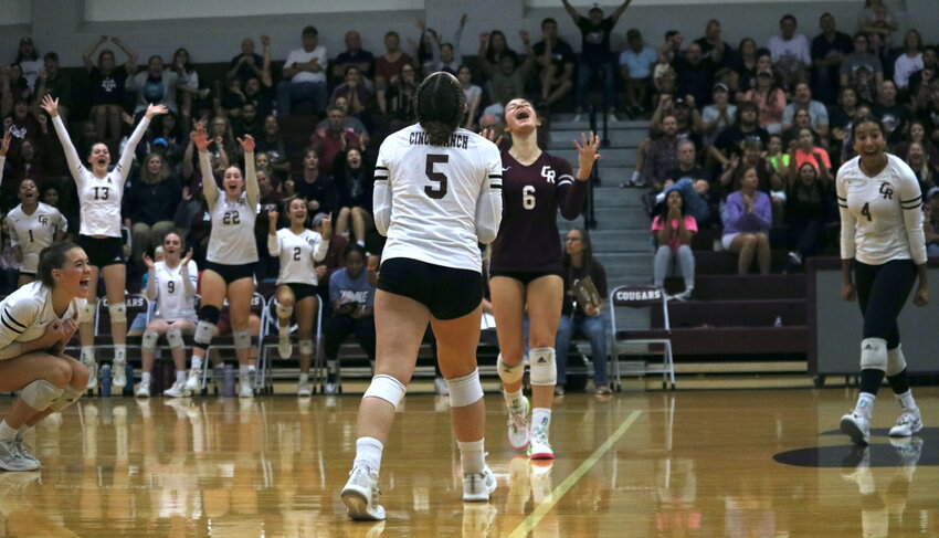 Cinco Ranch players celebrate after winning a set during Tuesday&rsquo;s match between Cinco ranch and Seven Lakes at the Cinco Ranch gym.