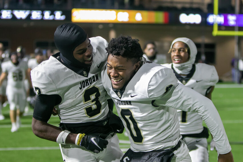 Andrew Marsh and Zion Jones celebrate after beating Morton Ranch on Thursday at Legacy Stadium.
