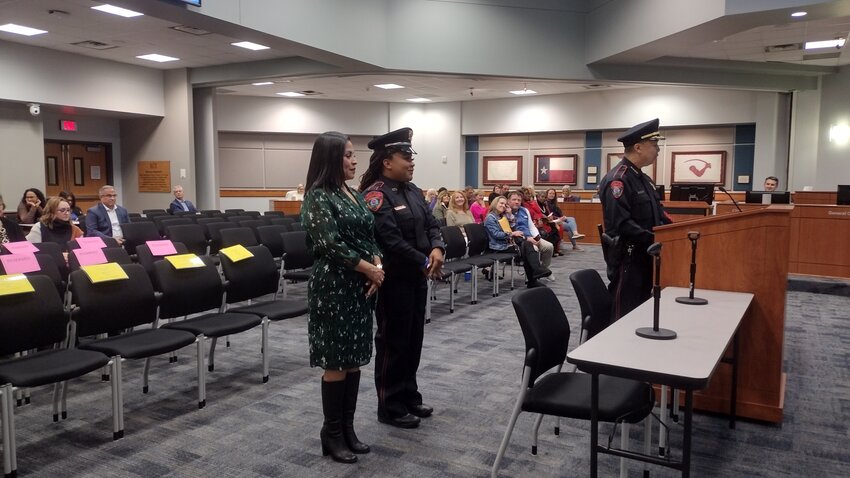 New KISD officer Xoco Thomas is sworn in during Monday night&rsquo;s school board meeting.