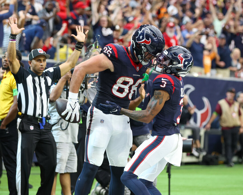 Texans tight end Dalton Schultz (86) celebrates with Texans wide receiver Tank Dell (3) after scoring on a 9-yard touchdown catch in the fourth quarter of an NFL game between the Houston Texans and the Tampa Bay Buccaneers on November 5, 2023 in Houston.