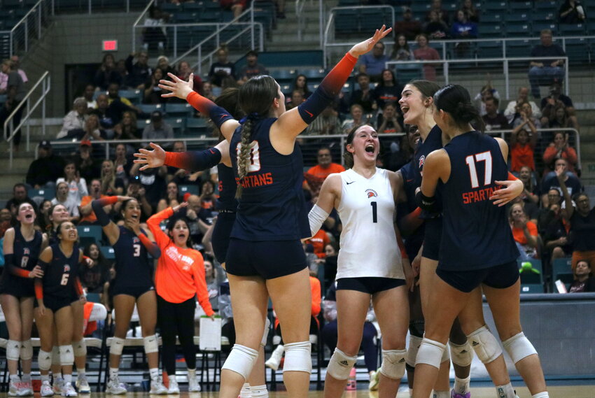 Seven Lakes players celebrate after winning a set during Tuesday&rsquo;s match between Seven Lakes and Tompkins at the Merrell Center.