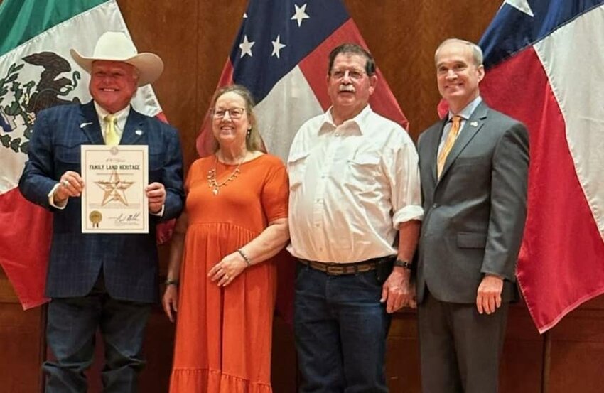 Texas Agriculture Commissioner Sid Miller (left) presents the Family Land Heritage Certificate of Honor to Kay Beckendorff Sword and her husband Perry Sword in Austin on October 18th, as State Representative Mike Schofield looks on.