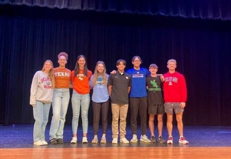 Seven Lakes student athletes pose for a photo on national signing day.