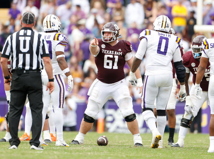 Texas A&amp;M center Bryce Foster (61) points at a defender before a play during an SEC college football game between LSU and Texas A&amp;M on November 25, 2023, in Baton Rouge.  LSU won, 42-30.