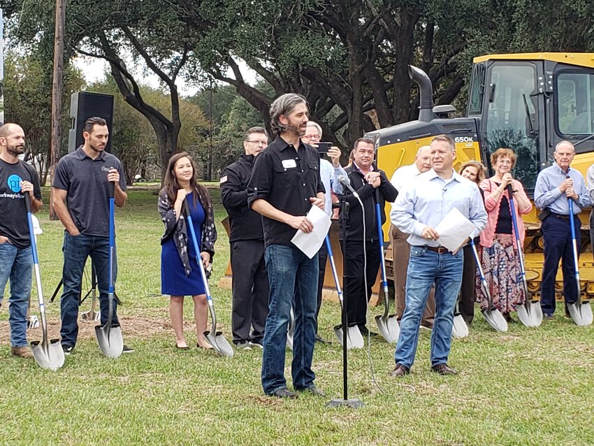 Adam Jungeblut (center), residency director at Parkway Fellowship&rsquo;s north Katy campus, leads the groundbreaking ceremony held November 19th at the church&rsquo;s new location at 5911 Morton Road in Katy. Senior Pastor Mike McGowan (right, in white) also spoke at the event, which attracted a large crowd of several hundred people.