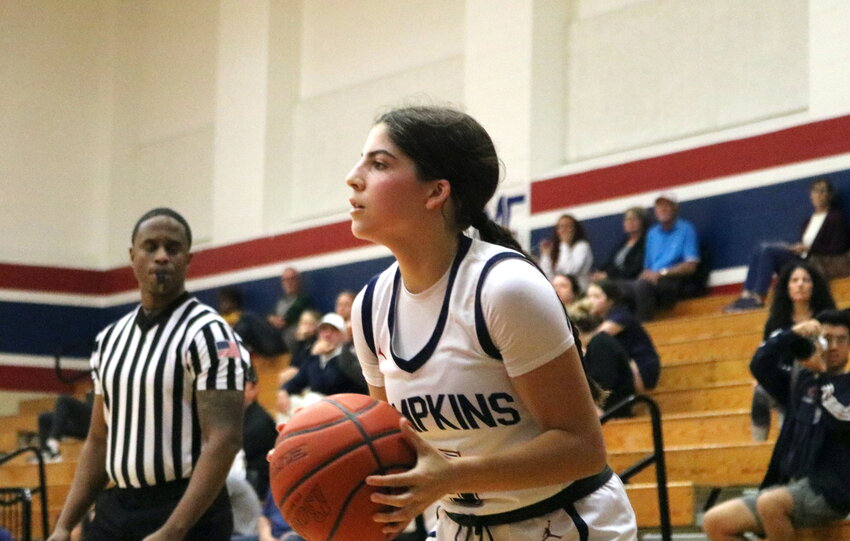 Sascha Coughran shoots a 3-pointer during Friday's game between Taylor and Tompkins at the Tompkins gym.
