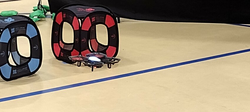 A drone approaches a section of the obstacle course at the drone competition at Harmony School of Excellence on Saturday.