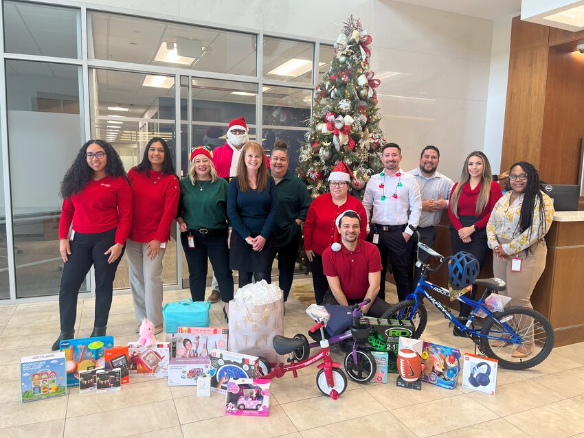 Members Choice Credit Union (MCCU) employees adopted eight children as part of the Santa&rsquo;s Sleigh Christmas Program for Katy Christian Ministries (KCM) in the spirit of the holiday season. From left to right are MCCU associates Llanly Estupinan, Syeda Hameed, Katrina Otto, Roseanna West, Ana Moreno, Maria Gomez, Jose Liu, John Padilla, Jackie Segura, and Shalonda Guidry. In the back row is Tim Garrity, and in the front row is Joey Waddell. Supporting the local community is core to MCCU&rsquo;s mission, and through its partnership with Katy Christian Ministries, the team is glad to make this an enjoyable time of year for local families in need, an MCCU spokesperson said. The photo was taken at MCCU&rsquo;s headquarters in Katy.