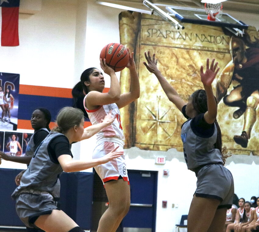 Shreya Jategaonkar shoots a jumper during Monday&rsquo;s game between Seven Lakes and Paetow at the Seven Lakes gym.