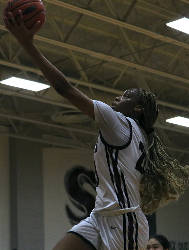 Aniya Foy shoots a layup during Tuesday&rsquo;s game between Cinco Ranch and Katy at the Katy gym.