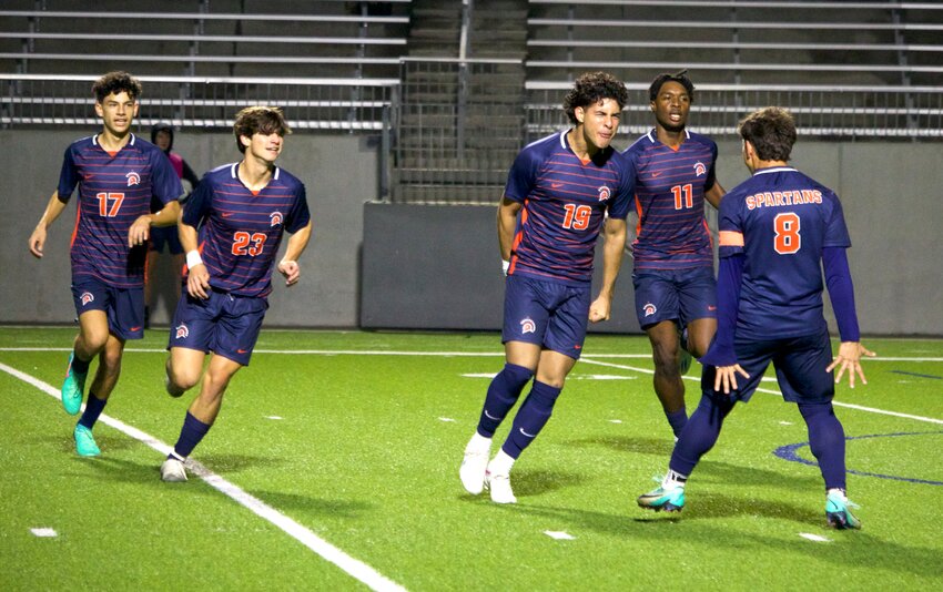 Jesus Duque and Fernando Lazo celebrate after Duque scored a goal during Friday&rsquo;s game between Seven Lakes and Jordan at Legacy Stadium.