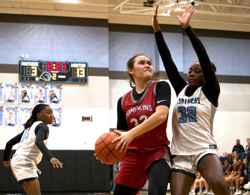 Rihanna DeLeon tries to shoot a layup over a defender during Tuesday&rsquo;s game between Tompkins and Paetow at the Paetow gym.