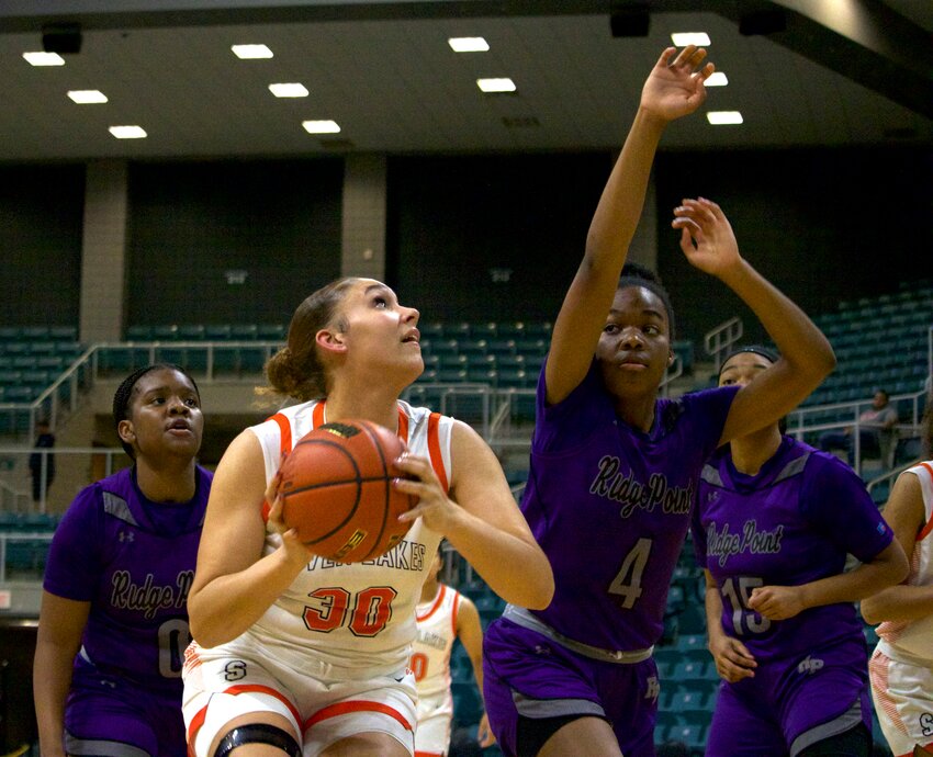 Justice Carlton goes up for a shot during Tuesday&rsquo;s game between Seven Lakes and Ridge Point at the Merrell Center.