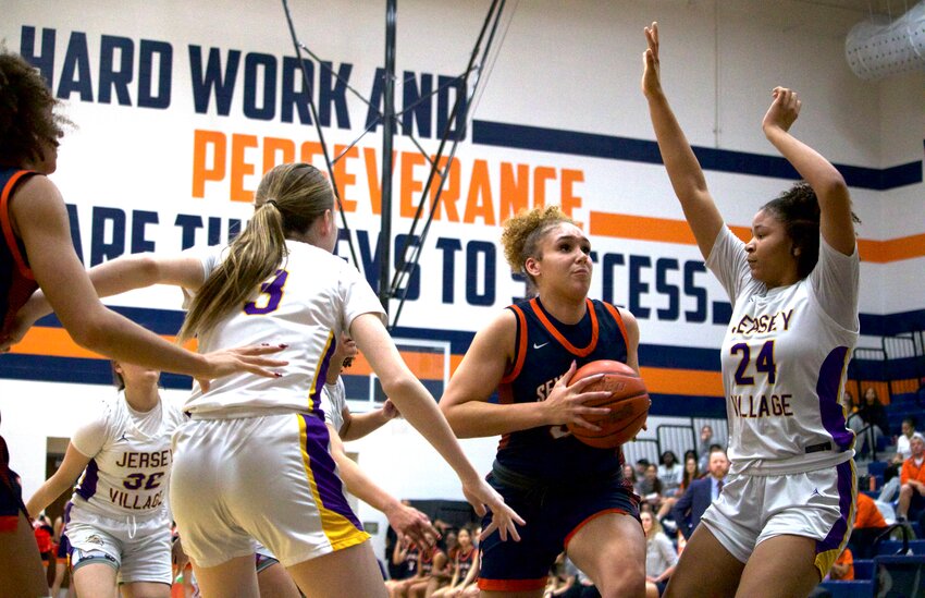 Justice Carlton drives to the lane during Friday&rsquo;s game between Seven Lakes and Jersey Village at Bridgeland High School.