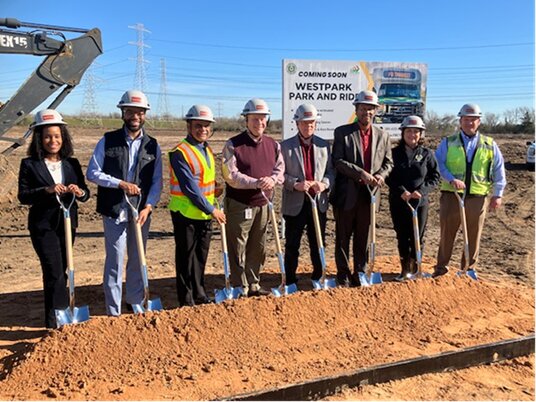 Pictured from left to right: Sarah Coulter (Assistant Transit Director), Fort Bend County Commissioner Dexter McCoy, Fort Bend County Judge KP George, Fort Bend County Commissioner Vincent Morales, Fort Bend County Commissioner Andy Meyers, Fort Bend County Commissioner Grady Prestage, Perri D&rsquo;Armond (Transit Director), David Ajlani (SpawGlass Operations Manager)
