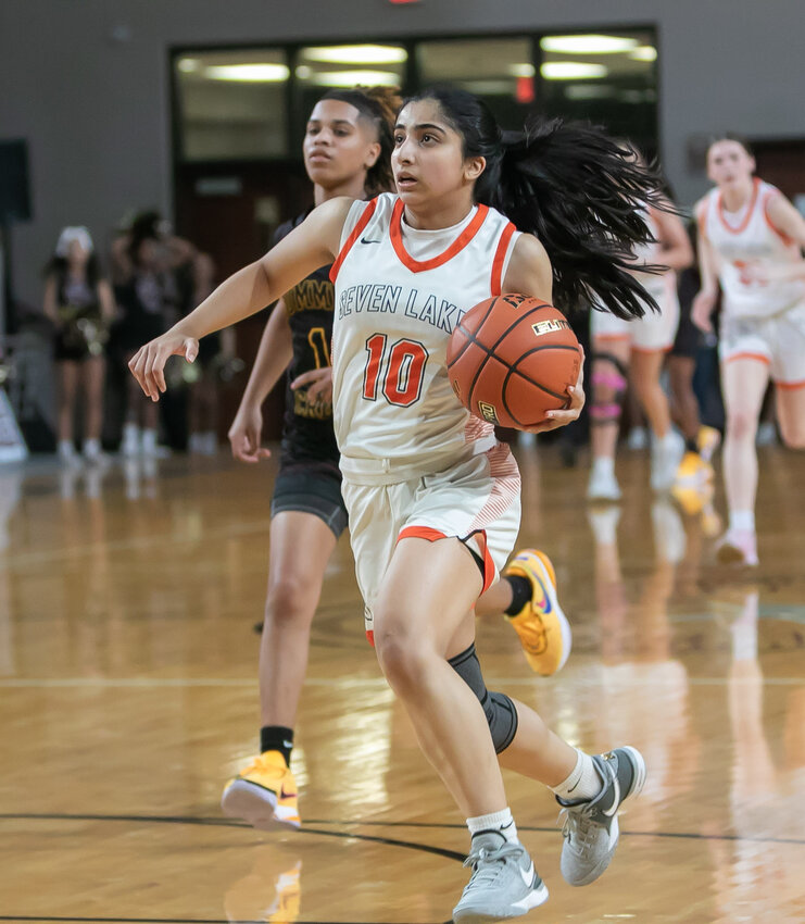 Shreya Jategaonkar drives to the basket during Friday's Region III-6A Semifinal between Seven Lakes and Summer Creek at the Campbell Center in Aldine.