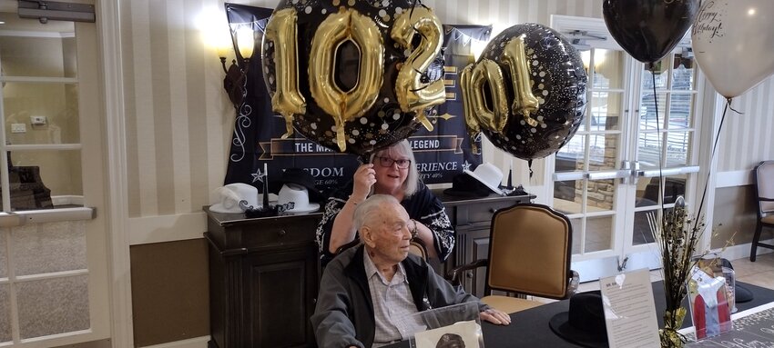 Staff and fellow residents of Cinco Ranch Alzheimer&rsquo;s Special Care Unit honored resident Ray Randall with a &ldquo;Vintage Man&rdquo; birthday bash on Friday, February 16th, as he prepared to celebrate his 102nd birthday on Sunday. Randall, shown with his daughter Claudie Bourgeois of Fulshear, is a World War II veteran who flew C46 and C47 planes over the China-Burma-India supply route while serving in the Army Air Corps (the predecessor to the U.S. Air Force).