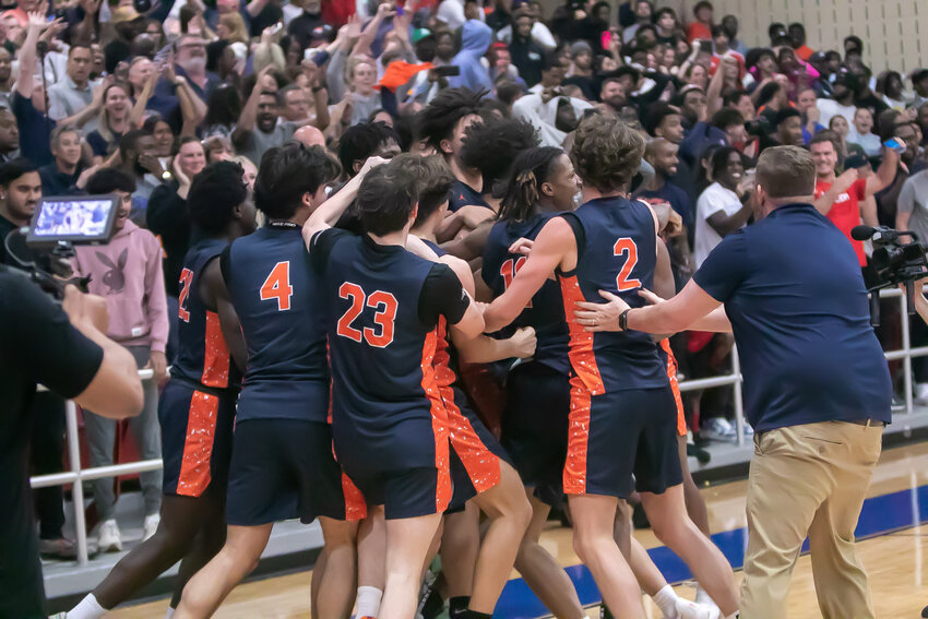 Seven Lakes players celebrate after Tillman Jaramillo's game winning shot during Tuesday's game between Seven Lakes and Clements at Wheeler Fieldhouse.