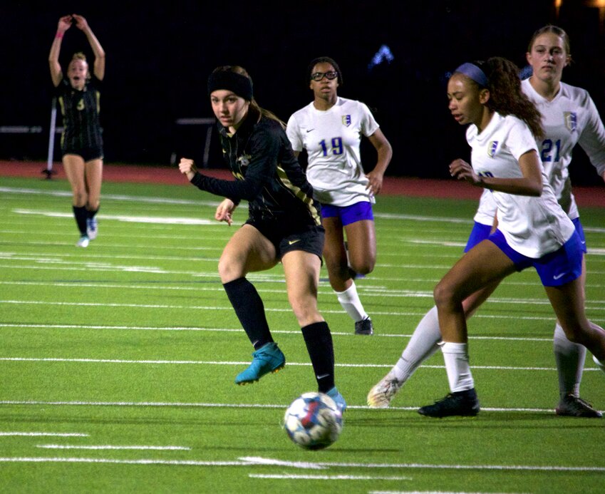 Madison Lambert passes the ball during Tuesday&rsquo;s bi-district game between Jordan and Elkins at the Jordan athletic field.