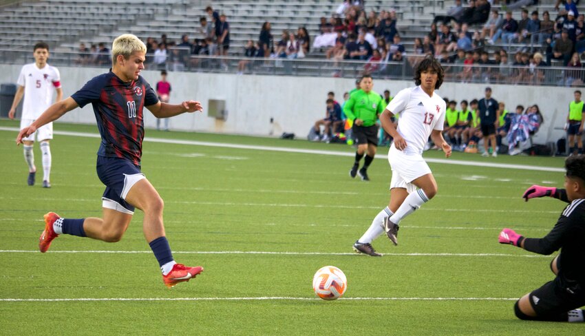 Braden Lehner tries to shoot past the Northbrook keeper during Friday&rsquo;s area round game between Tompkins and Northbrook at Legacy Stadium.