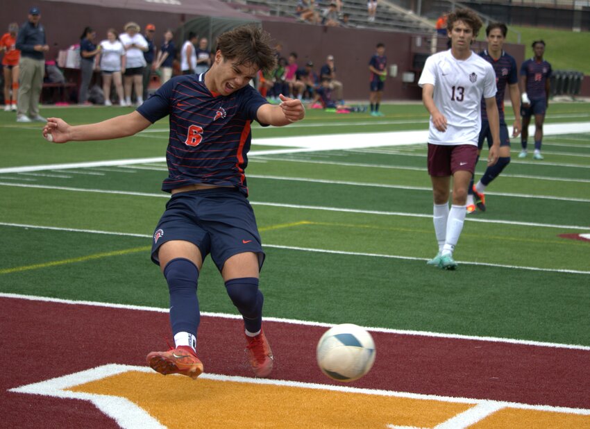 Kortay Koc crosses a ball during Saturday's Region III-6A Final between Seven Lakes and Cinco Ranch.