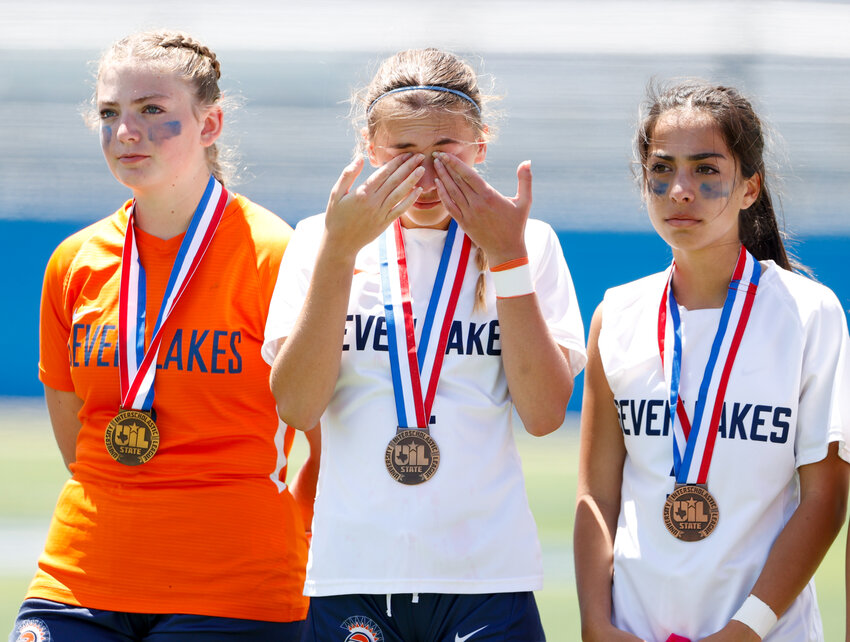 The Seven Lakes Spartans take a moment after receiving their state semifinalist medals following the Class 6A girls state soccer semifinal between Prosper and Seven Lakes on April 12, 2024 in Georgetown. Prosper won 3-0.