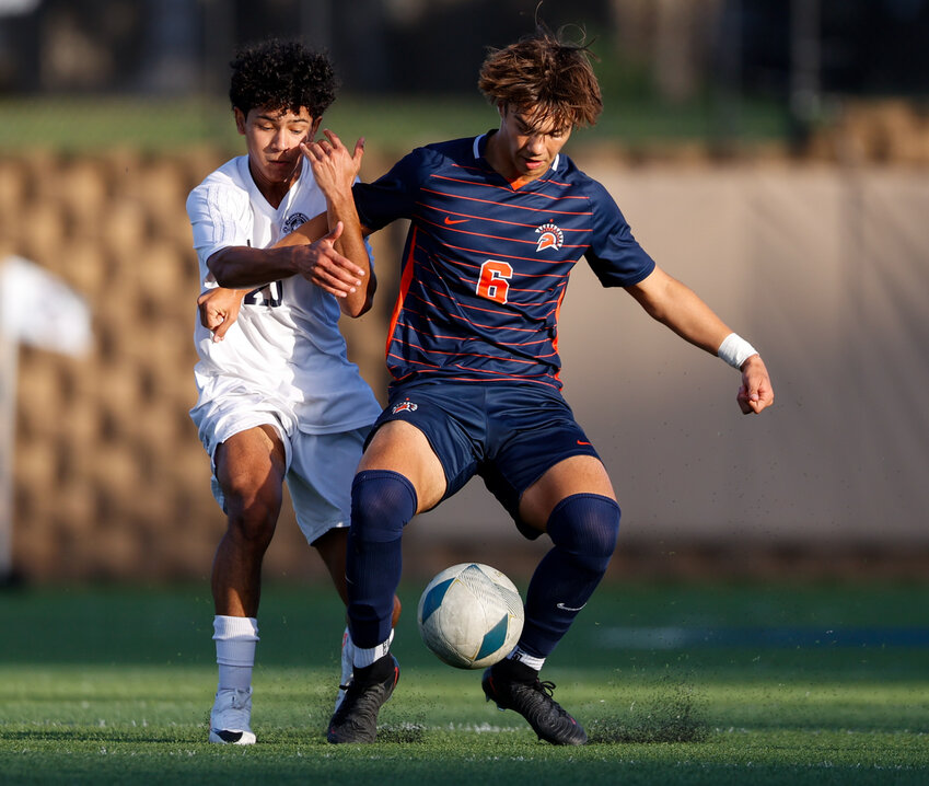 Seven Lakes midfielder Kortay Koc (6) works against Flower Mound midfielder Luis Garc&iacute;a (25) during the Class 6A boys state soccer championship between Seven Lakes and Flower Mound on April 13, 2024 in Georgetown.