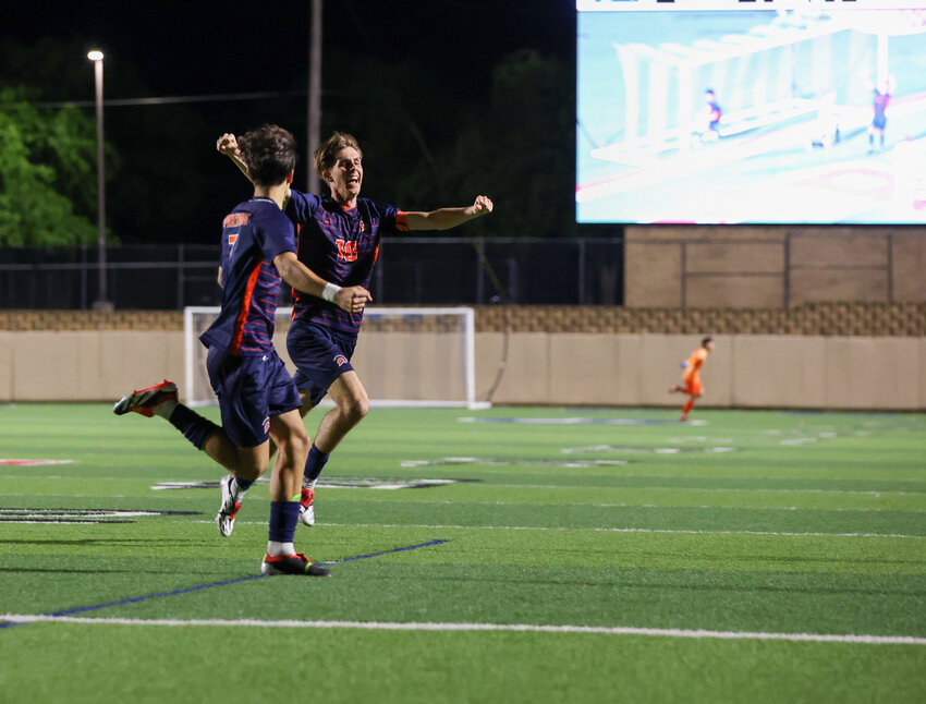 Seven Lakes defender Aidan Morrison (10) celebrates with forward Noa Stasic (left) after scoring the game-winning goal in the second overtime period of the Class 6A boys state soccer championship between Seven Lakes and Flower Mound on April 13, 2024 in Georgetown.