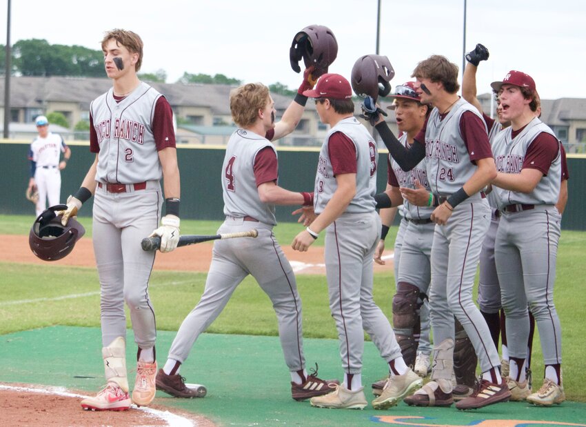 Cinco Ranch players celebrate after a Brock DeYoung home run during Tuesday&rsquo;s game between Cinco Ranch and Seven Lakes at the Seven Lakes baseball field.