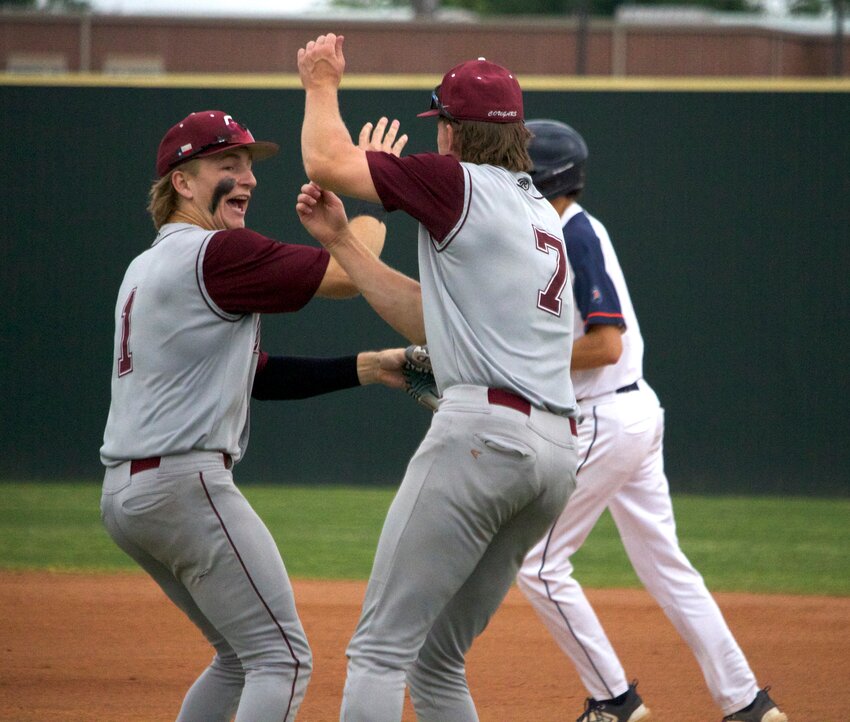 Karsten Kleiwig celebrates with Jase Morris after Kleiweg turned a double play during Tuesday&rsquo;s game between Cinco Ranch and Seven Lakes at the Seven Lakes baseball field.