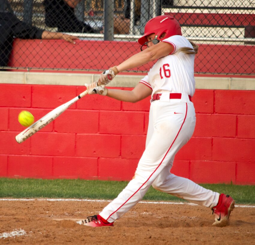 Hailey Gore hits during Friday&rsquo;s bi-district round game between Katy and Dulles at the Katy softball field.