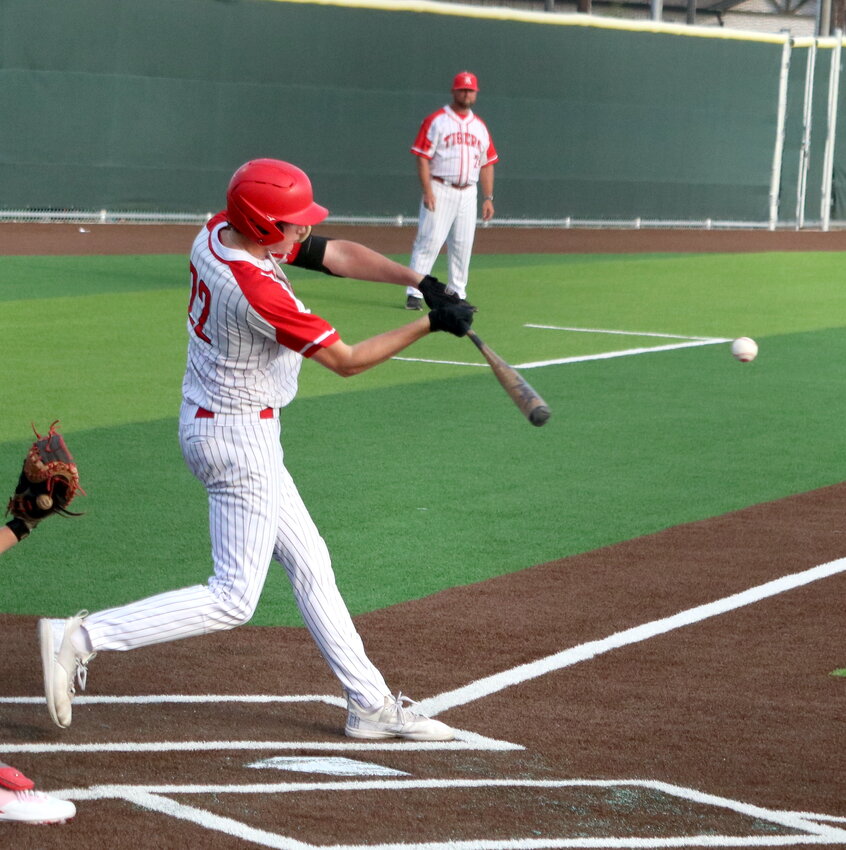 Cade Nelson hits during Friday&rsquo;s bi-district round game between Katy and Fort Bend Travis at the Cy-Park baseball field.