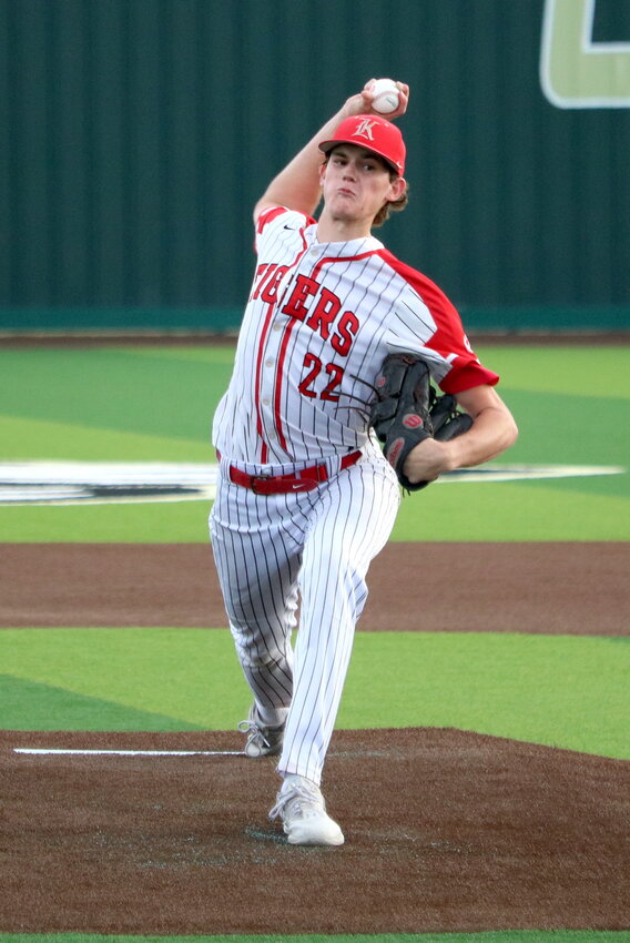 Cade Nelson pitches during Friday&rsquo;s bi-district round game between Katy and Fort Bend Travis at the Cy-Park baseball field.