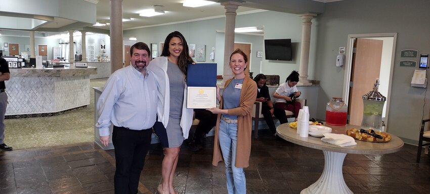 During the April 17th ribbon cutting for Casa Azul, Director of Business Development Saul Gauthier (left) and administrator Kara Garman (center) were presented with a Certificate of Special Congressional Recognition from the office of Troy Nehls, U.S. House of Representatives District 22 by Katy Area Chamber of Commerce Vice President/Business Development Stacy Jacobs. Caza Azul, located at 1480 Katy Flewellen Road in Katy at the site of the former Spanish Meadows, is a rehabilitation facility and nursing home specializing in respiratory therapy.