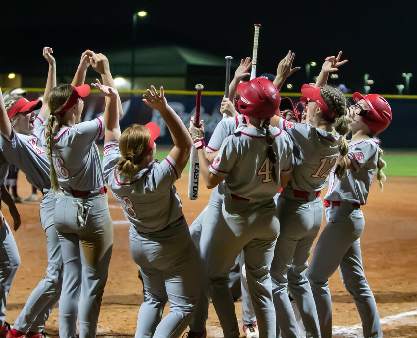 Katy players celebrate after a home run during Thursday&rsquo;s game between Katy and Cinco Ranch at the Tompkins softball field.