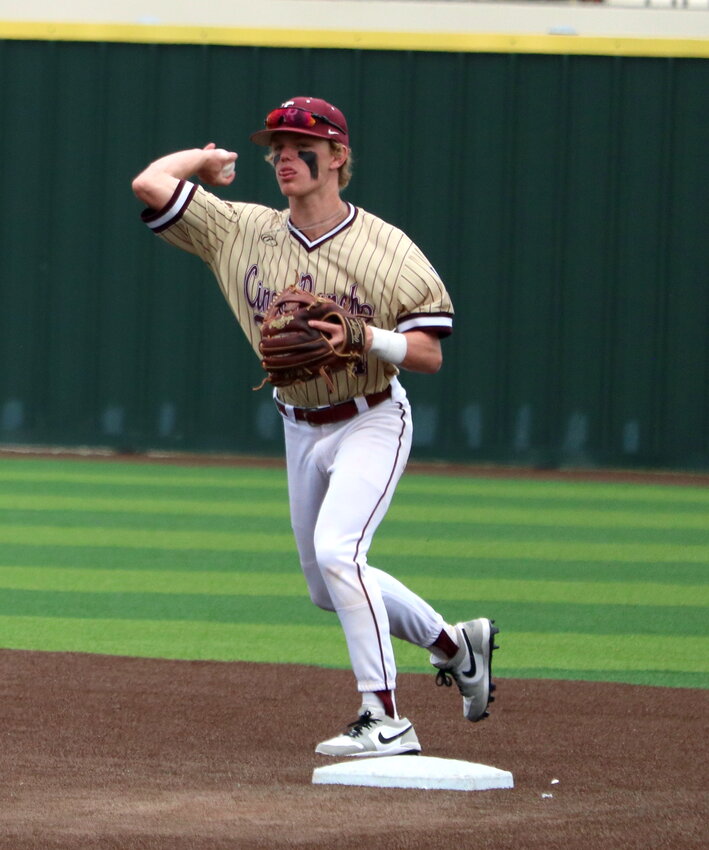 Brock DeYoung makes a throw to first base during an area round game between Cinco Ranch and Stratford at Cy-Lakes.