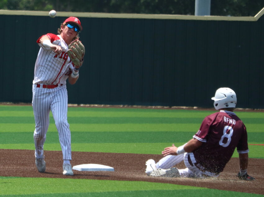 Sutton Hull turns a double play during Saturday&rsquo;s Region III-6A Quarterfinal game between Katy and Cy-Fair at Langham Creek.