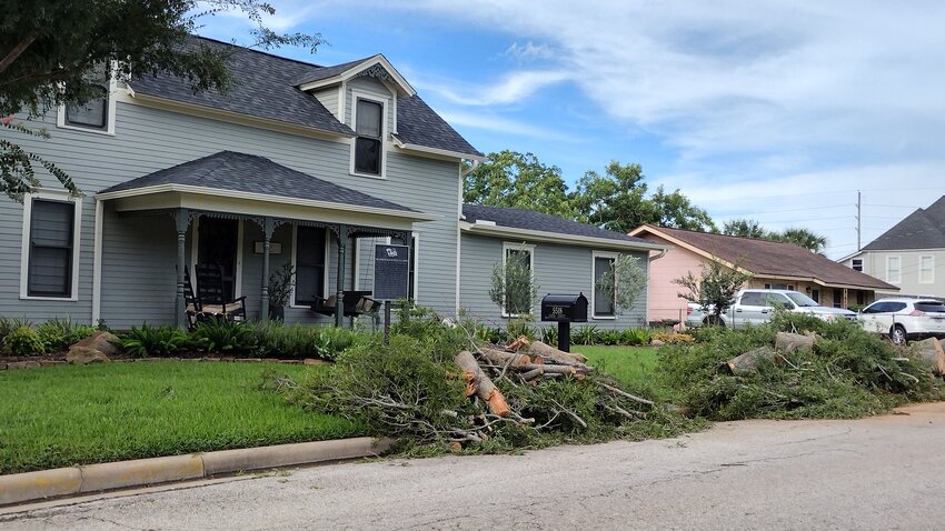 Mature trees at the historic Robertson-Motherall home at 5518 Fifth Street in Kay lie in pieces after being destroyed by Hurricane Beryl&rsquo;s strong winds.  This home was built sometime   between 1900 and 1910 by Frank Hart for Andrew Kendall Robertson.