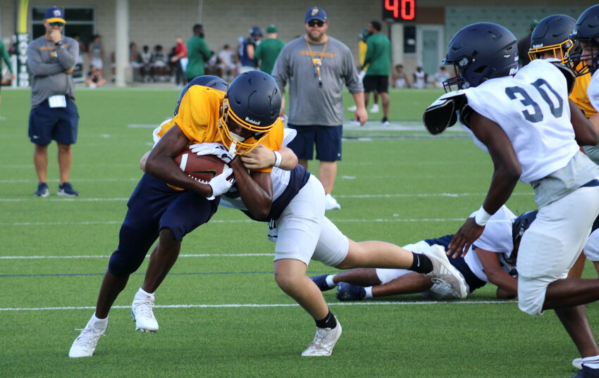 Christian Tillman runs into the endzone during a scrimmage between Freeman and Tompkins on Thursday.