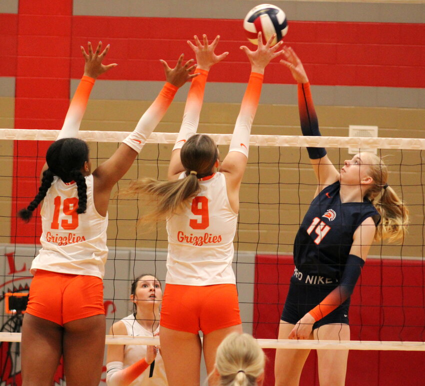 Seven Lakes&rsquo; Lily Lott tips a ball over the net during Saturday&rsquo;s Katy ISD/Cy-Fair Volleyball Classic Gold Bracket game.