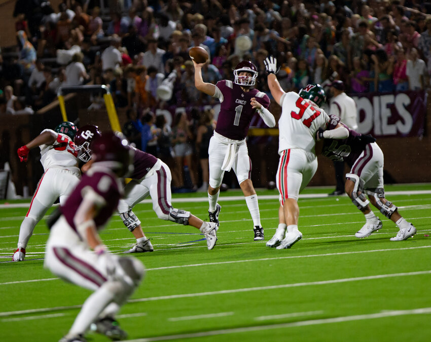 Charlie Adamoli makes a pass during Saturday&rsquo;s game between Cinco Ranch and The Woodlands at Rhodes Stadium.