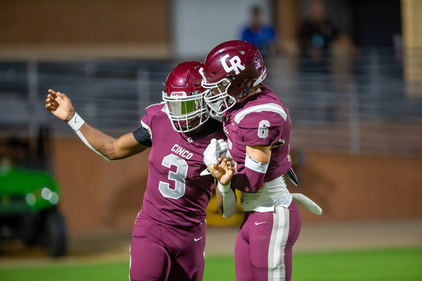 Marcus Gadlin celebrates with Scott Eckel after a touchdown during a game between Cinco Ranch and Seven Lakes at Rhodes Stadium.