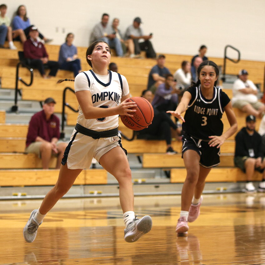 Sascha Coughran drives to the basket during Saturday&rsquo;s game between Tompkins and Ridge Point.